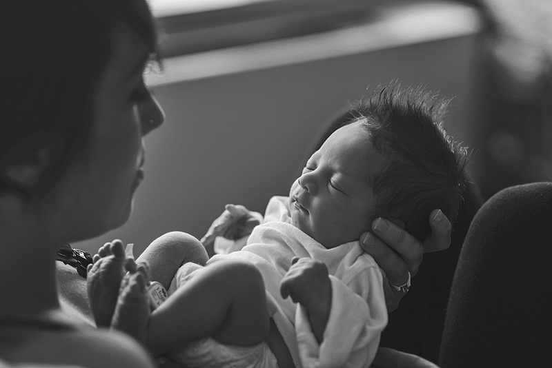 Mom holding newborn baby | St. Louis Birth Photographer | Jodie Allen
